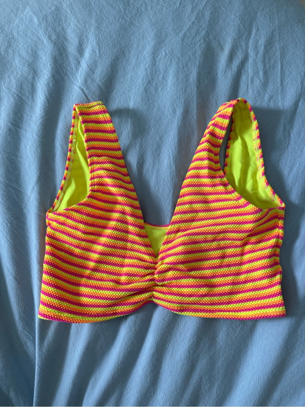 This item is a Montce Swim Kim Variation Top in the retro stripe neon colorway